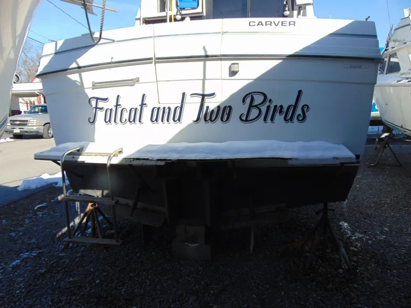 Slide: The Image of 1987 Carver Mariner 28 boat named "Fatcat and Two Birds" in a boatyard. - 3