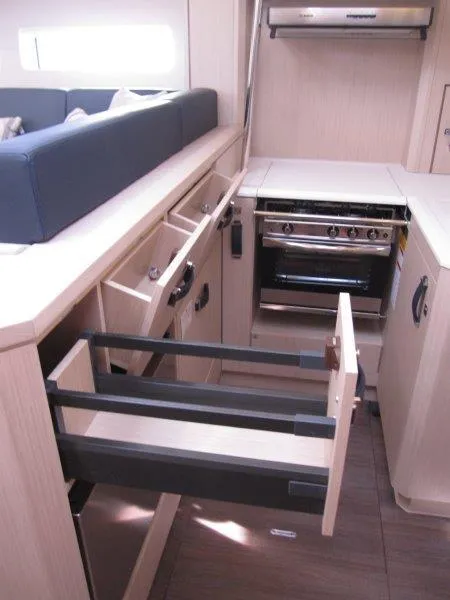 Slide: The Image of Modern kitchen in 2024 Jeanneau 60 yacht with open drawers and stove. - 14
