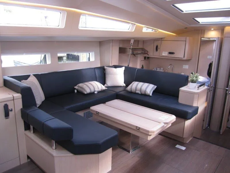 Slide: The Image of Luxurious interior of 2024 Jeanneau 60 yacht with spacious seating and modern design. - 1
