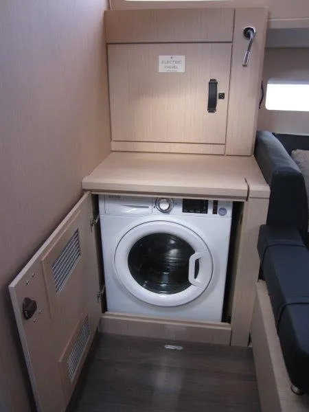 Slide: The Image of Built-in washing machine in the 2024 Jeanneau 60 yacht interior. - 23