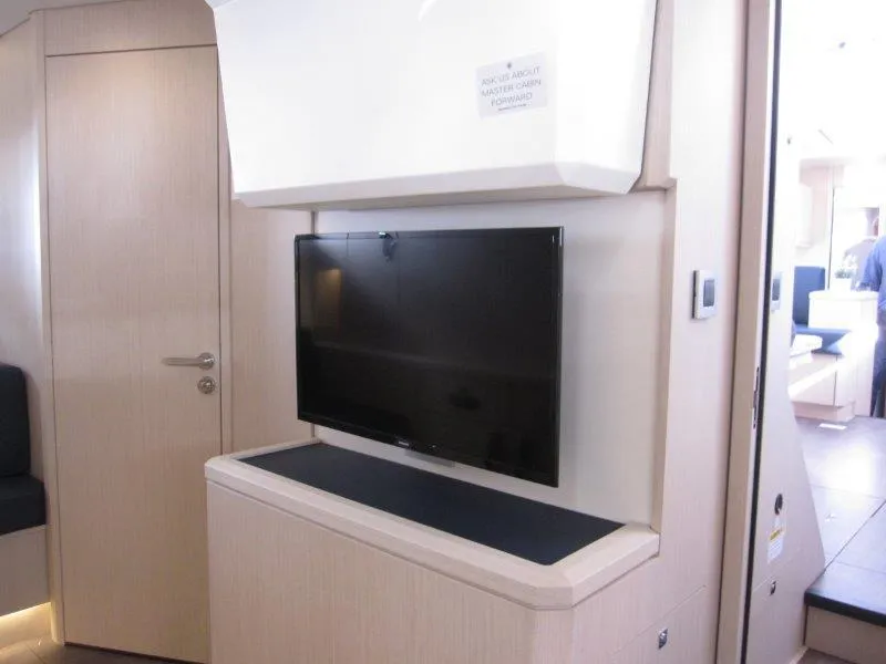 Slide: The Image of Modern interior of Jeanneau 60 yacht 2024 with mounted flat-screen TV. - 44