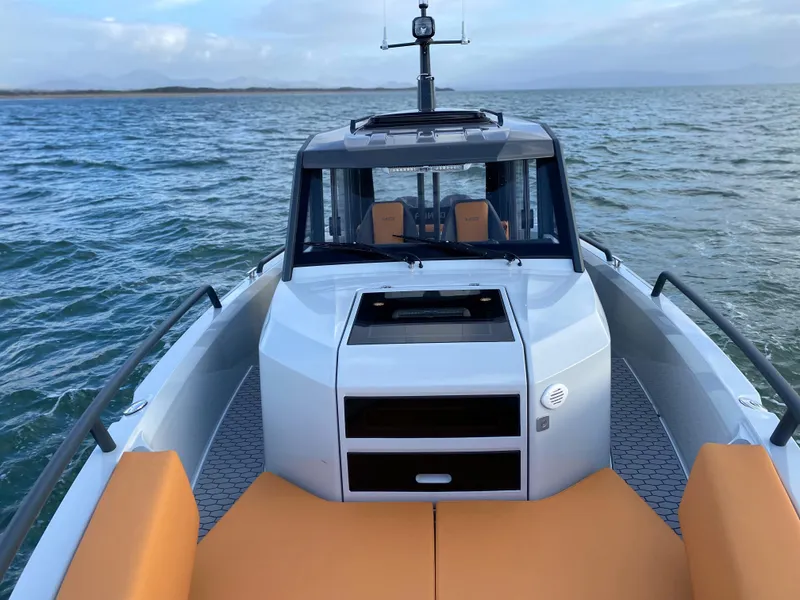 Slide: The Image of 2023 XO Boats Defender 9 on open water. - 13