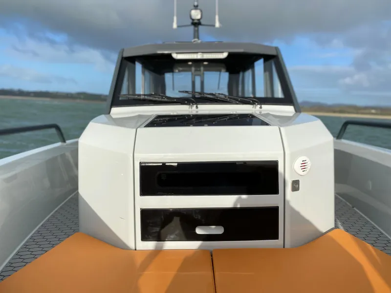 Slide: The Image of 2023 XO Boats Defender 9 on water, front view. - 33