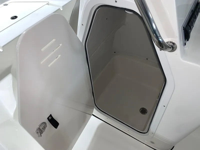Slide: The Image of 2024 Key West 189 FS boat storage compartment with open hatch. - 11