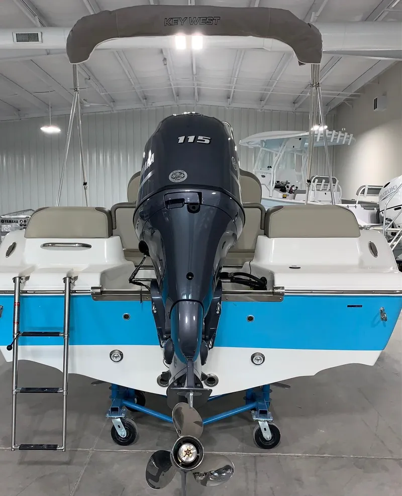 Slide: The Image of 2024 Key West 189 FS boat with 115 HP engine in showroom. - 2
