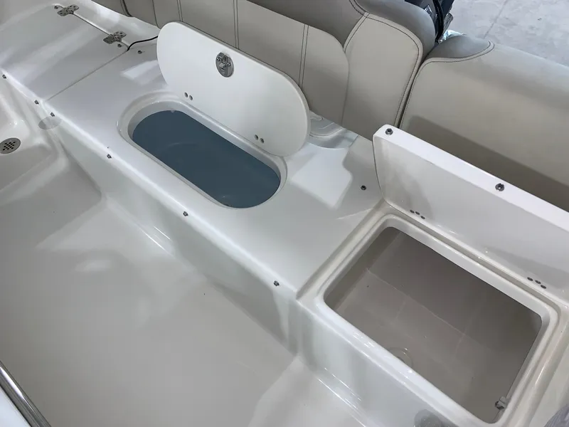 Slide: The Image of 2024 Key West 189 FS boat interior with storage compartments open. - 8