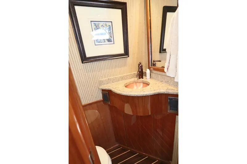 Slide: The Image of Luxurious bathroom in 2013 Viking 66 yacht with elegant wood and granite finishes. - 11