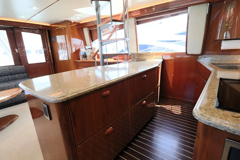 Slide: The Image of Luxurious interior of 2013 Viking 66 yacht with elegant wood and granite finishes. - 12