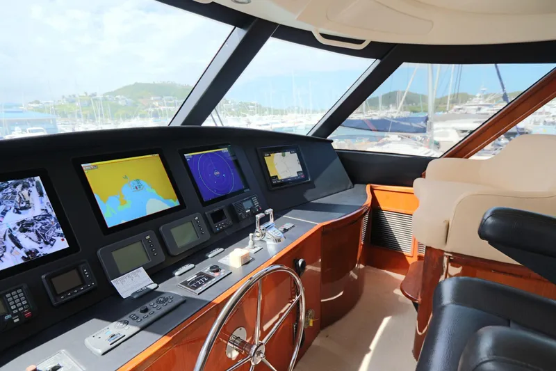 Slide: The Image of Cockpit of 2013 Viking 66 yacht with navigation screens and steering wheel. - 20