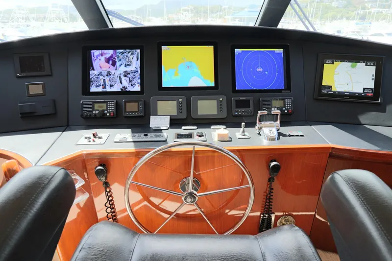 Slide: The Image of Pilothouse of 2013 Viking 66 yacht with navigation screens and controls. - 22