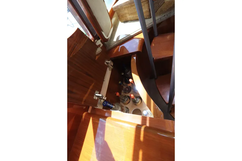 Slide: The Image of Interior of 2013 Viking 66 yacht with wooden cabinetry and built-in bottle storage. - 23