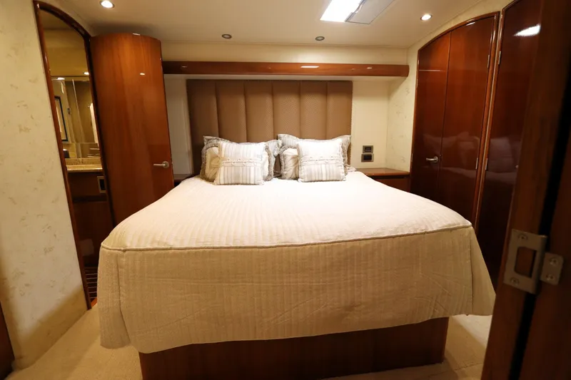 Slide: The Image of Luxurious bedroom interior of 2013 Viking 66 yacht with elegant wood finishes. - 25