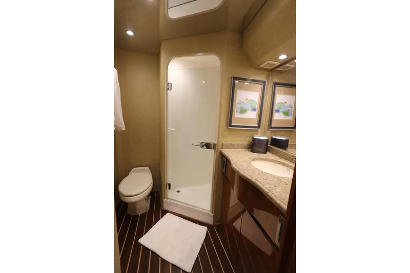 Slide: The Image of Luxurious bathroom in 2013 Viking 66 yacht with shower, toilet, and elegant vanity. - 32