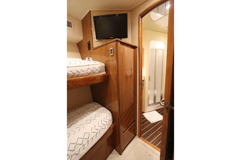 Slide: The Image of Interior of 2013 Viking 66 yacht with bunk beds and bathroom. - 36