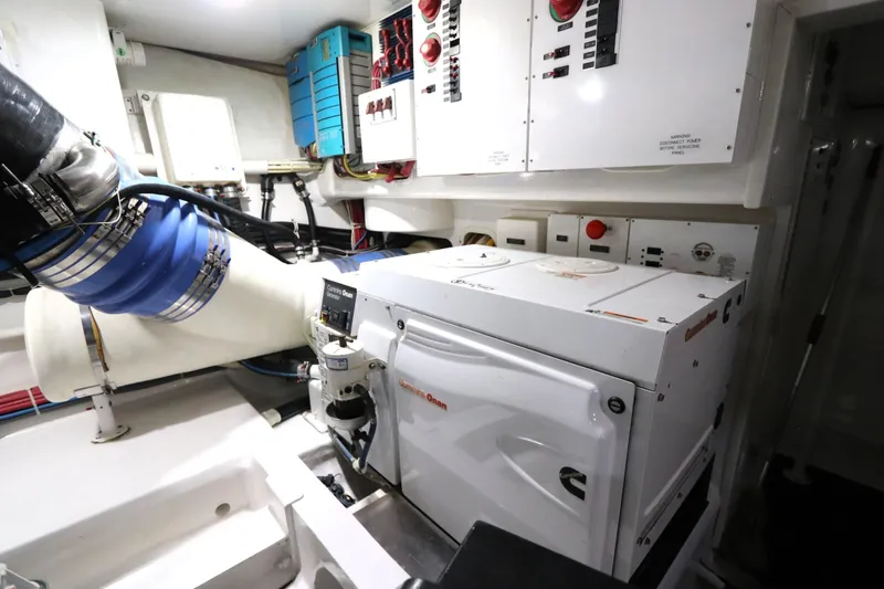 Slide: The Image of Engine room of 2013 Viking 66 yacht with Cummins Onan generator and control panels. - 45