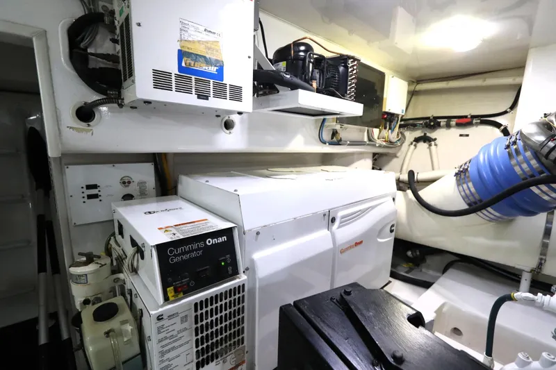 Slide: The Image of Engine room of 2013 Viking 66 yacht with Cummins Onan generator and equipment. - 46