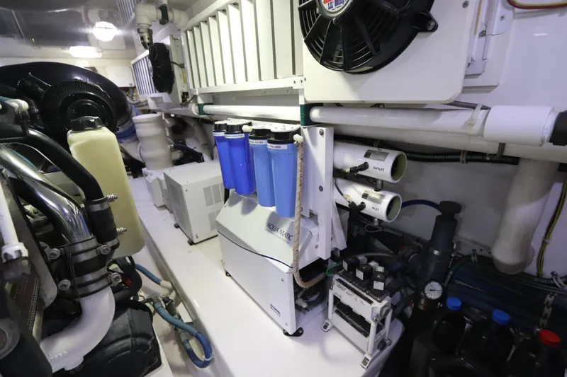 Slide: The Image of Engine room of 2013 Viking 66 yacht with filtration system and mechanical components. - 50