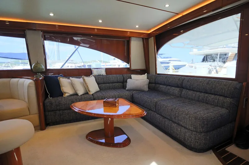 Slide: The Image of Luxurious interior of 2013 Viking 66 yacht with plush seating and elegant wooden table. - 7