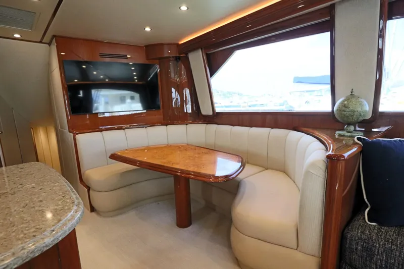 Slide: The Image of Luxurious interior of 2013 Viking 66 yacht with elegant dining area and large windows. - 8