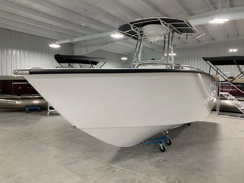 Slide: The Image of 2024 Cape Horn 22 OS boat in indoor showroom. - 2