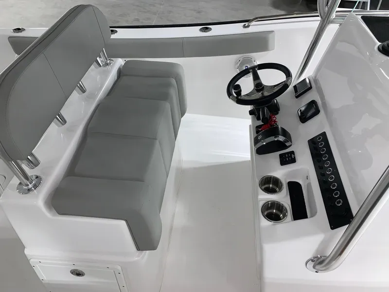Slide: The Image of 2024 Cape Horn 22 OS boat interior with steering console and seating. - 8