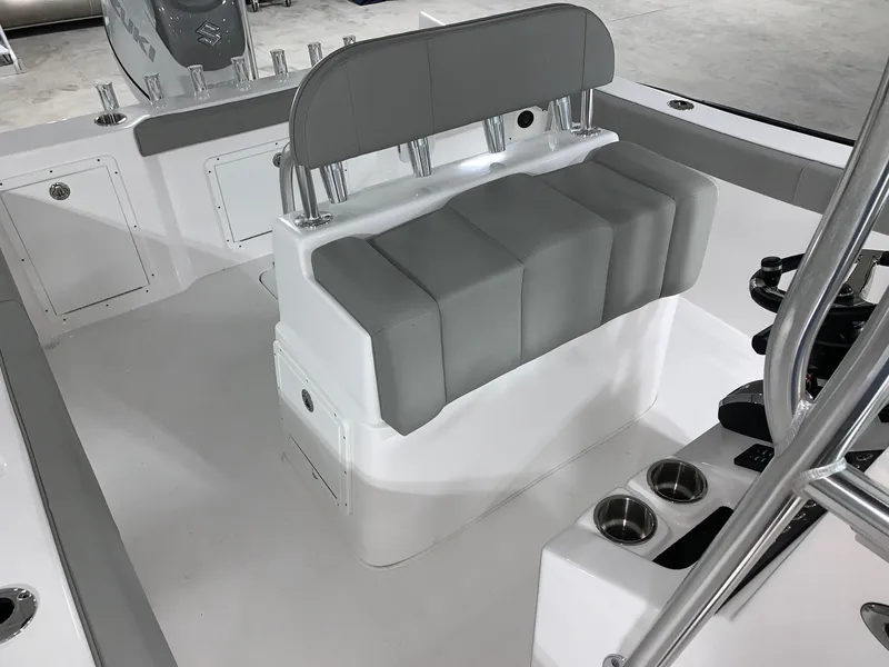 Slide: The Image of 2024 Cape Horn 22 OS boat interior with cushioned seating and rod holders. - 10