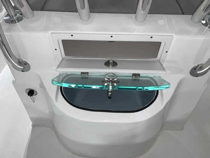 Slide: The Image of Cape Horn 22 OS 2024 boat console with storage compartments and rod holders. - 3