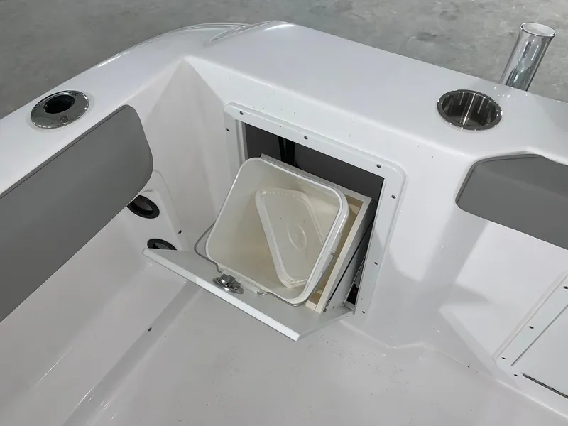 Slide: The Image of 2024 Cape Horn 22 OS boat with open storage compartment and cup holders. - 4