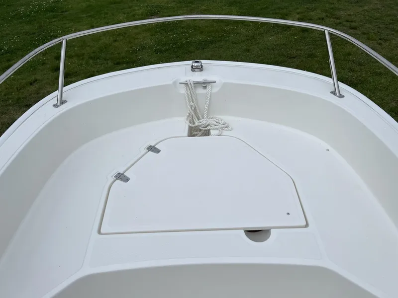 Slide: The Image of 2024 Boston Whaler 160 Super Sport bow with anchor storage and railing. - 14