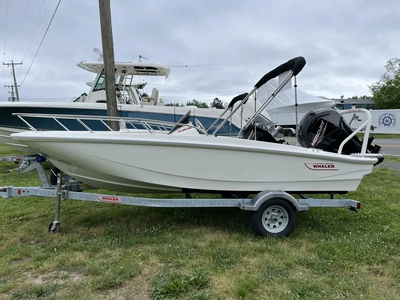 Slide: The Image of 2024 Boston Whaler 160 Super Sport boat on trailer, side view. - 19