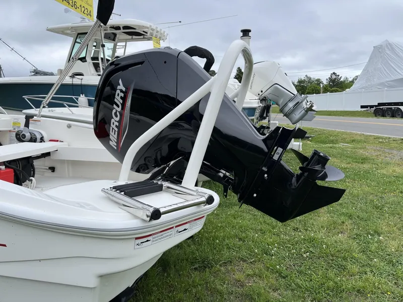 Slide: The Image of 2024 Boston Whaler 160 Super Sport with Mercury outboard motor on display. - 2
