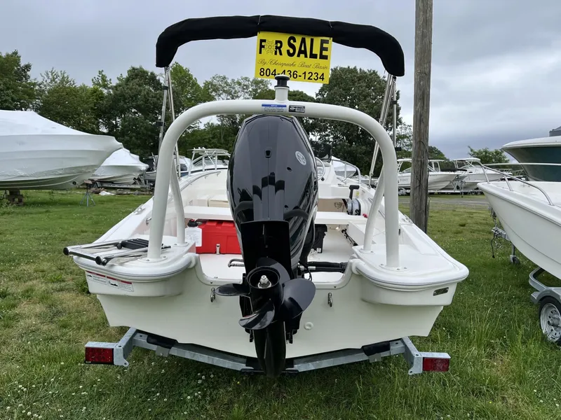 Slide: The Image of 2024 Boston Whaler 160 Super Sport boat for sale, rear view with motor. - 21