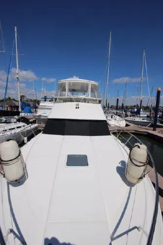 Slide: The Image of 2001 Silverton 42 Convertible Yacht in harbor. - 14