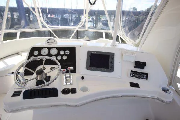 Slide: The Image of Silverton 42 Convertible 2001 helm with instruments and steering wheel. - 16