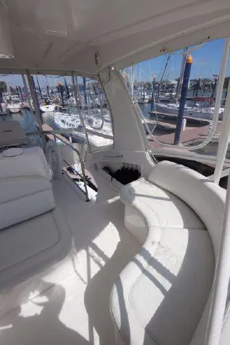 Slide: The Image of Interior of a 2001 Silverton 42 Convertible yacht in a marina. - 19