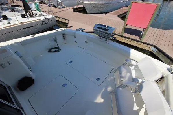 Slide: The Image of 2001 Silverton 42 Convertible boat deck with seating area. - 22