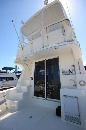 Slide: The Image of 2001 Silverton 42 Convertible Yacht, white deck and upper deck. - 24