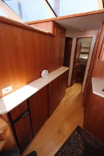 Slide: The Image of Interior of 2001 Silverton 42 Convertible yacht with wood finish. - 35