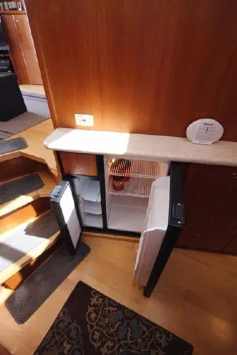 Slide: The Image of Kitchen area of 2001 Silverton 42 Convertible with open fridge. - 36