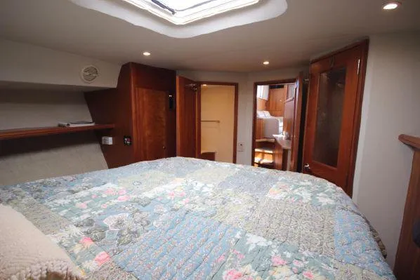 Slide: The Image of Interior of 2001 Silverton 42 Convertible with cozy bedroom. - 44