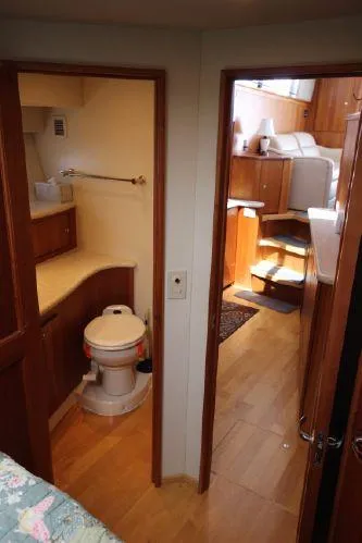 Slide: The Image of Interior of 2001 Silverton 42 Convertible yacht with bathroom and living area. - 45