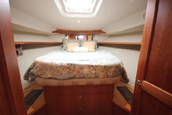 Slide: The Image of Interior of 2001 Silverton 42 Convertible with cozy bed. - 46