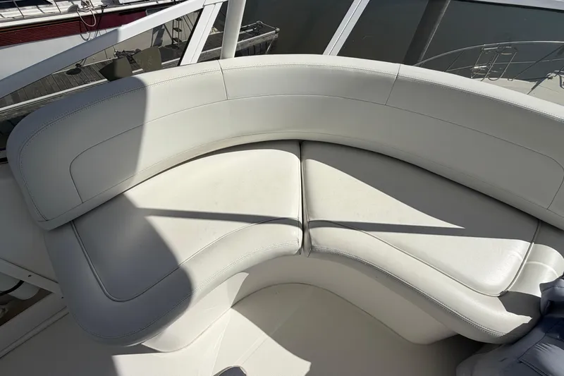 Slide: The Image of 2001 Silverton 42 Convertible yacht with white leather seating on deck. - 69