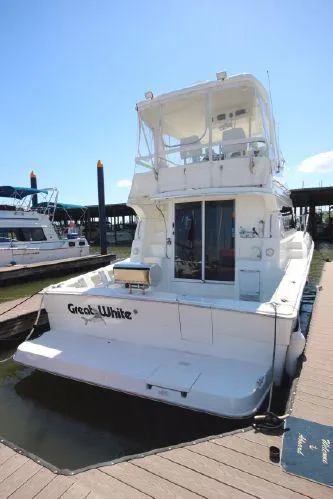 Slide: The Image of 2001 Silverton 42 Convertible Yacht at the dock. - 8