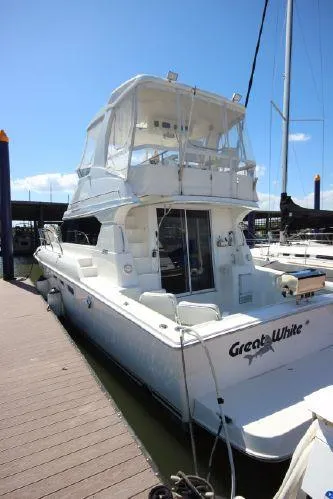 Slide: The Image of 2001 Silverton 42 Convertible Yacht docked at marina. - 9