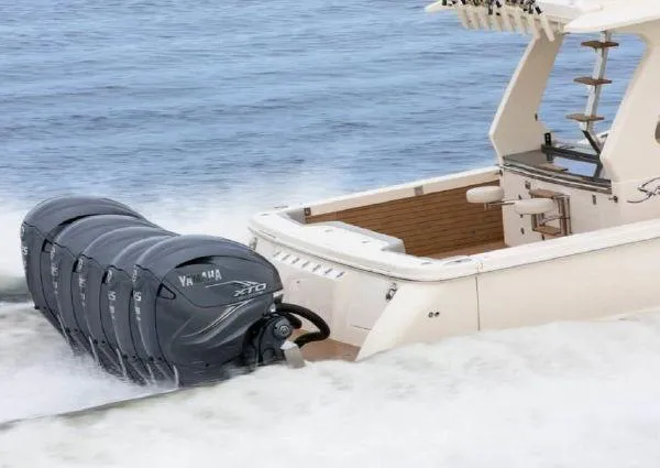 Slide: The Image of Scout 530 LXF 2026 with Yamaha XTO outboard engines on the water. - 2