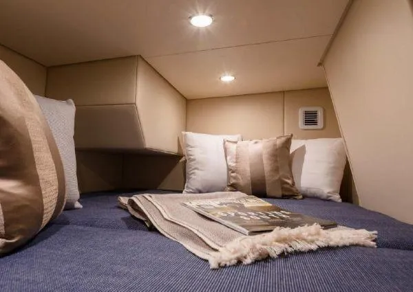 Slide: The Image of Interior of 2026 Scout 530 LXF with cozy bed and pillows. - 3
