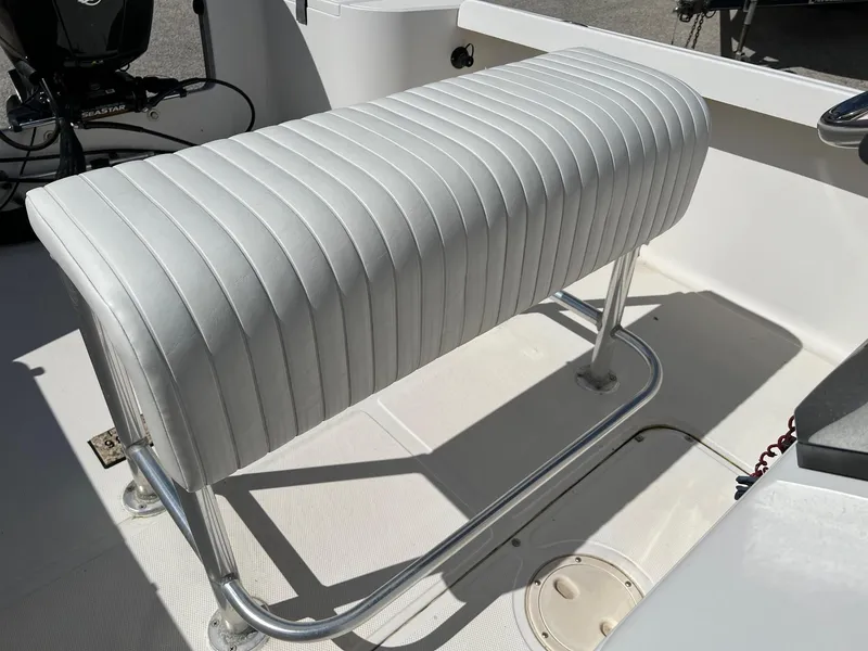 Slide: The Image of White cushioned bench seat on 1998 Sea Hunt 200 Triton boat deck. - 2
