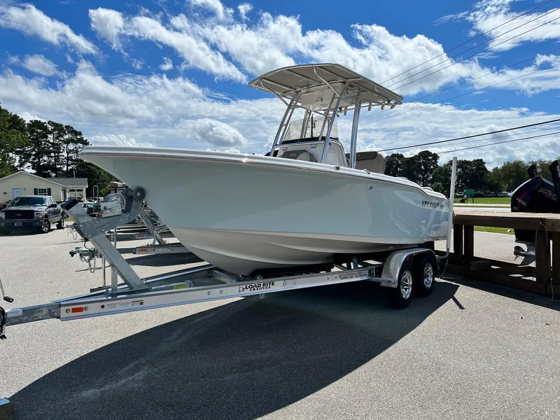 The Image of 2024 Key West 219 FS boat on a trailer under a blue sky. - 0
