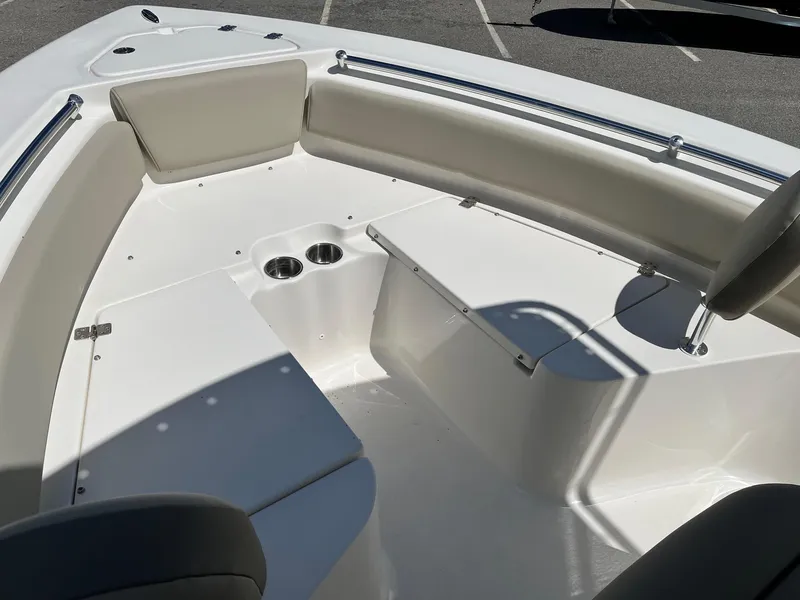 Slide: The Image of 2026 Key West 219 FS boat interior with seating and cup holders. - 11